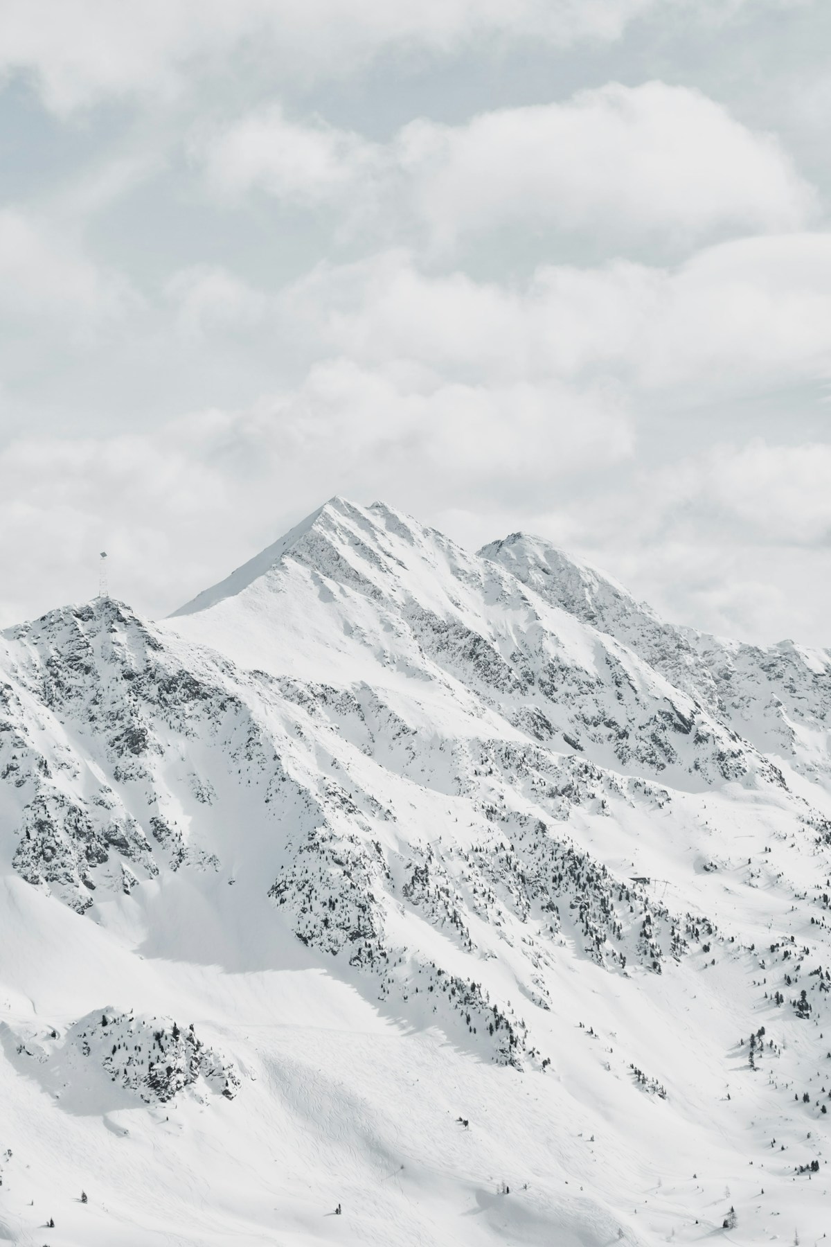 Snow-covered mountain peaks in Armenia under a clear winter sky