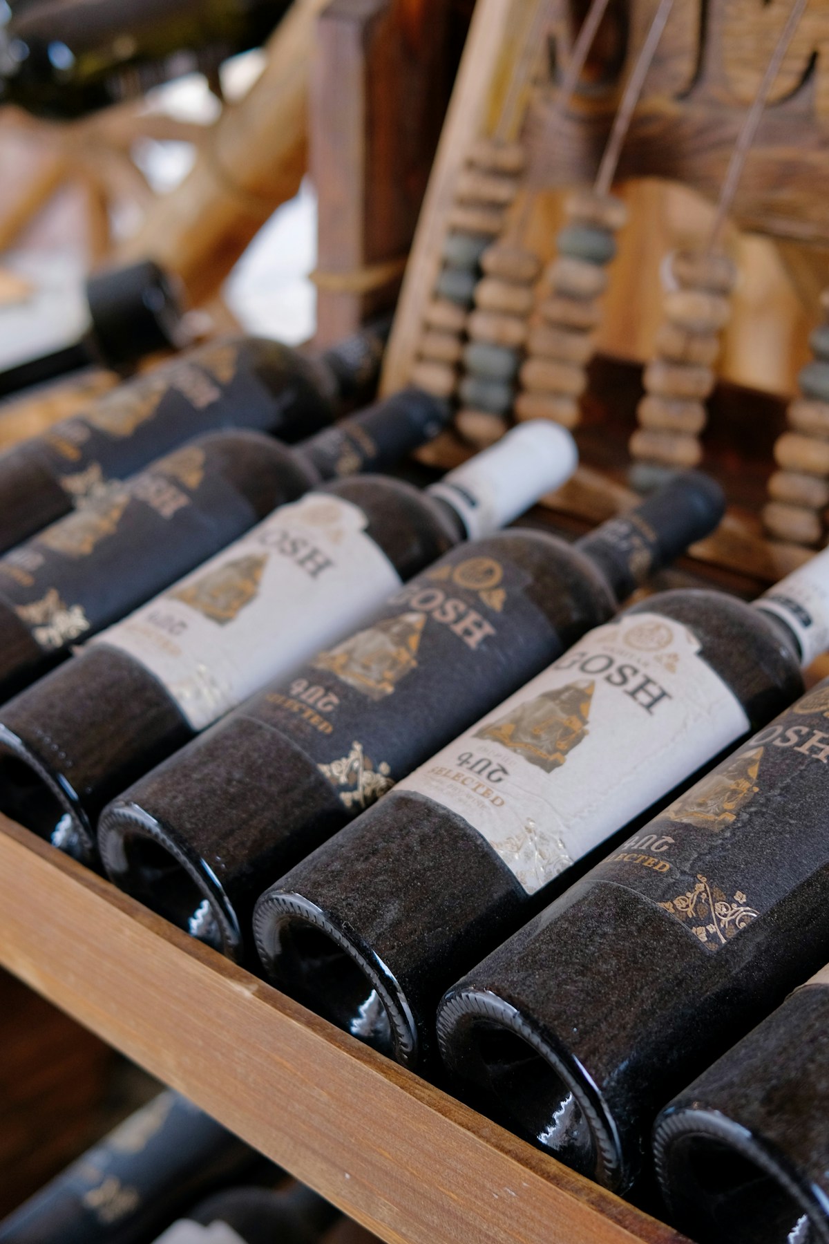 Wine bottles on a rack at an Armenian winery near Geghard