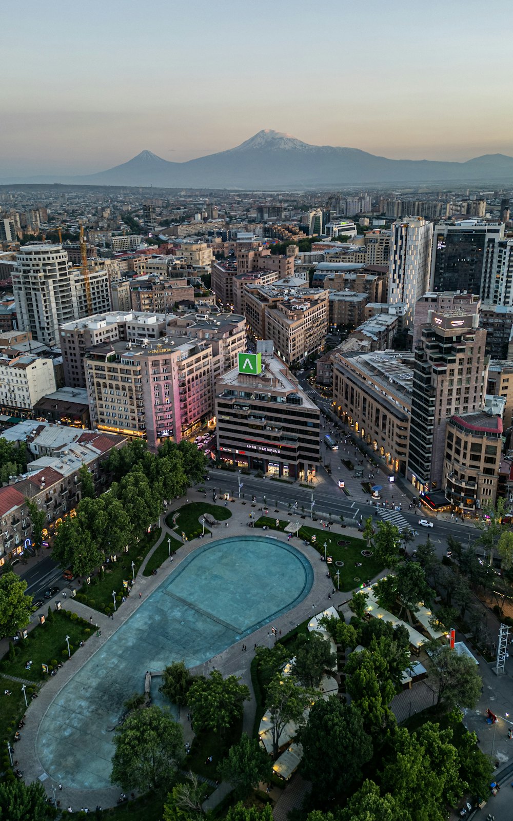 Aerial view of Yerevan at dusk with Mount Ararat in the background