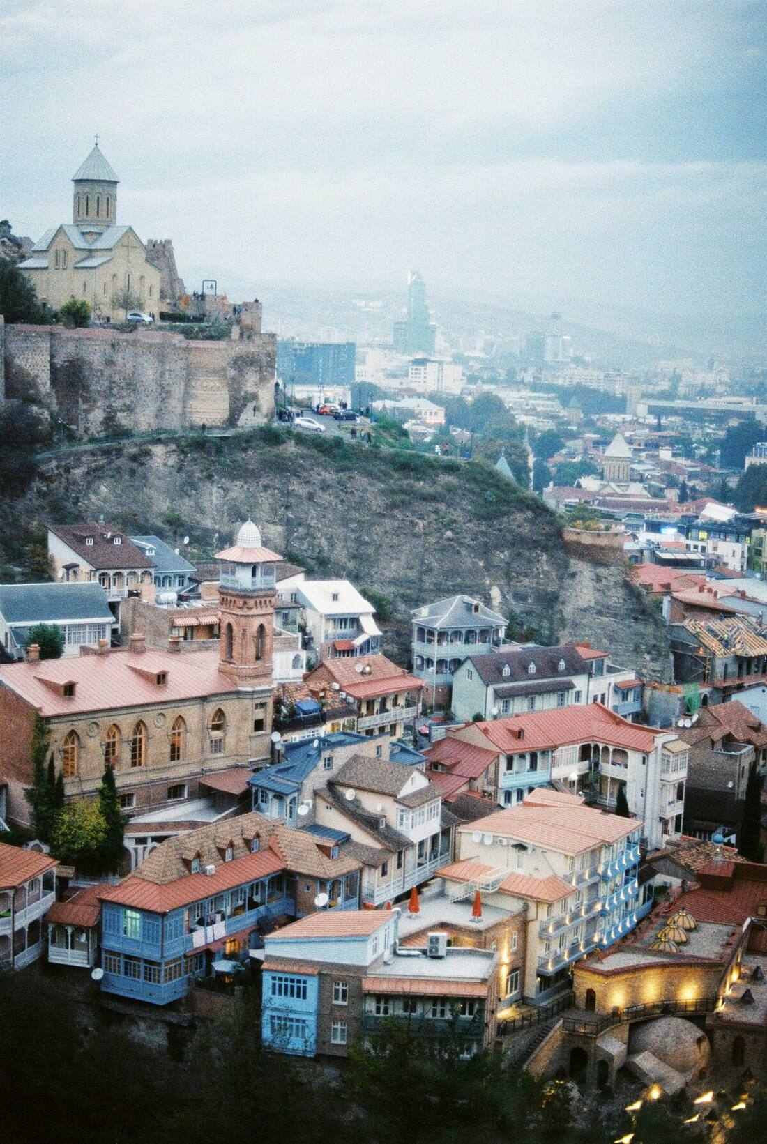 Tbilisi old town with historic churches and terracotta rooftops on hillside, Georgia