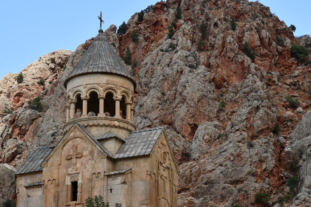 Noravank Monastery set against the red sandstone cliffs of the Amaghu River canyon, Armenia
