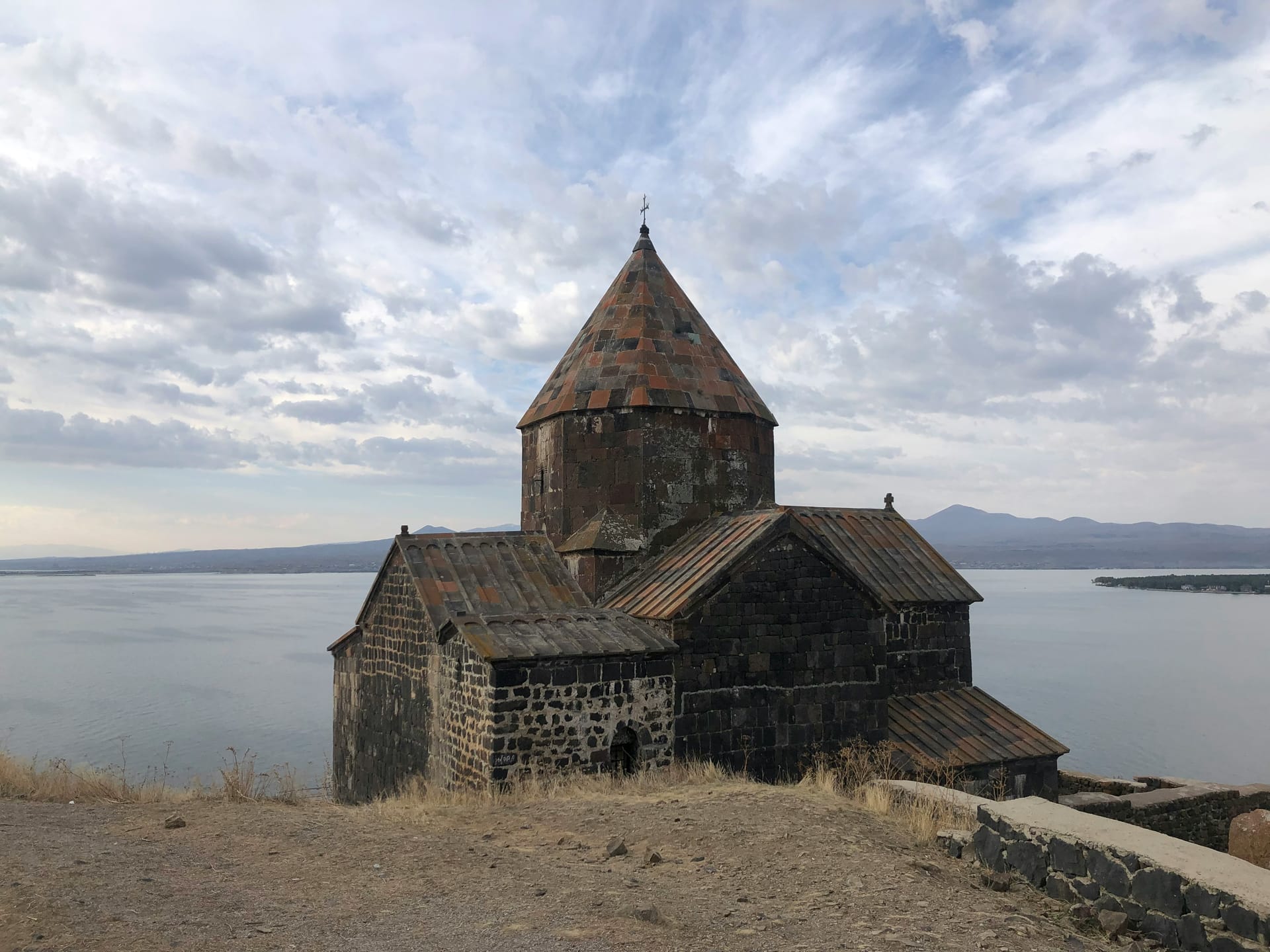 Sevanavank monastery church on the Sevan peninsula with Lake Sevan stretching behind it, Armenia