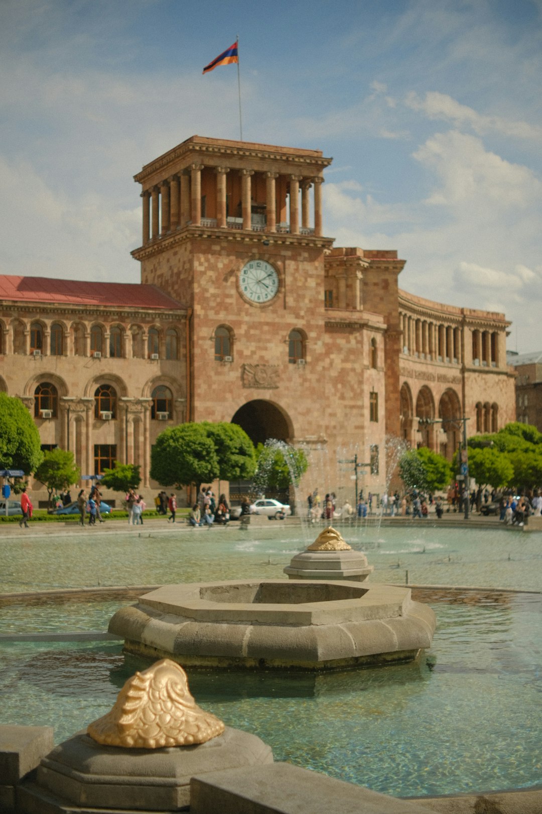 Republic Square in Yerevan, Armenia — the pink-stone Government Building with its central fountain and Armenian flag