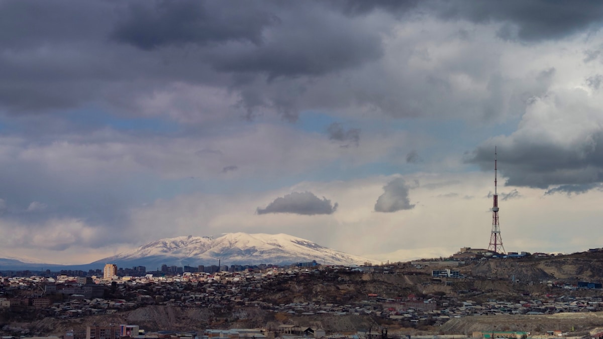 Snow-capped Mount Ararat rising behind the city of Yerevan — travel insurance for Armenia