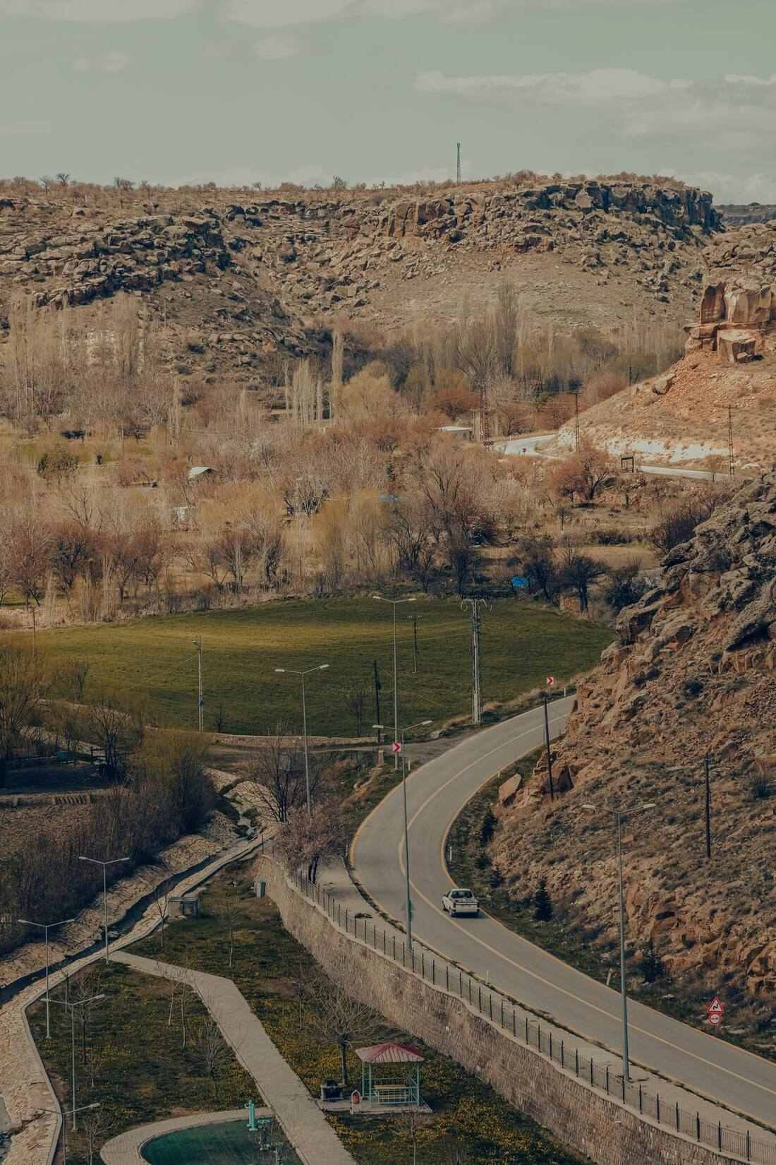 Winding road through rocky arid hills in southern Armenia on the Yerevan to Tehran corridor